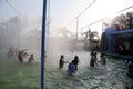 Teenage group of people enjoying holiday in water park.